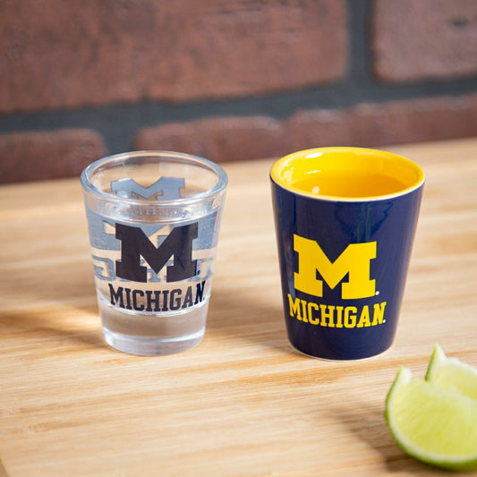 Team Sports America Recommended - University Of Michigan 4-Piece Ceramic and Glass 2oz. Shot Glass Set