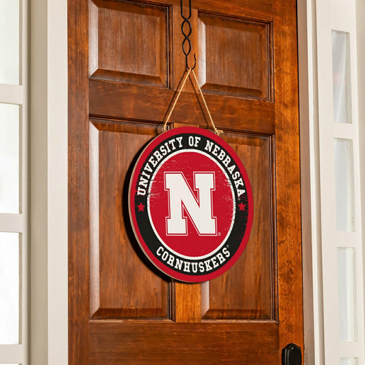 Team Sports America Trending - University of Nebraska Round Door Décor with Hanging Rope, 18x18