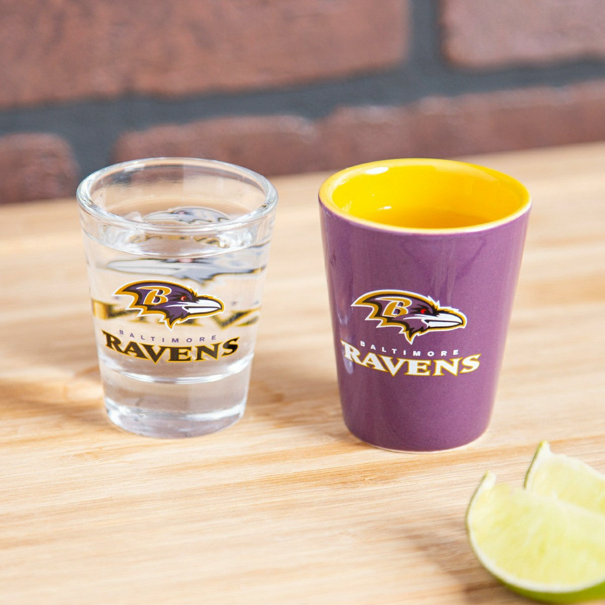 Team Sports America Classic - Baltimore Ravens 4-Piece Ceramic and Glass 2oz. Shot Glass Set